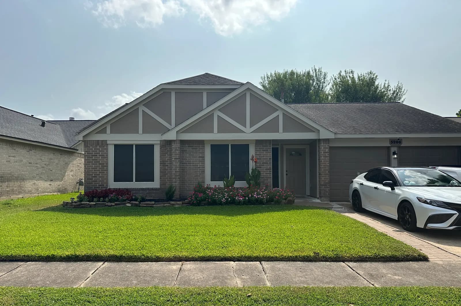 Front yard landscaping with fresh planting beds